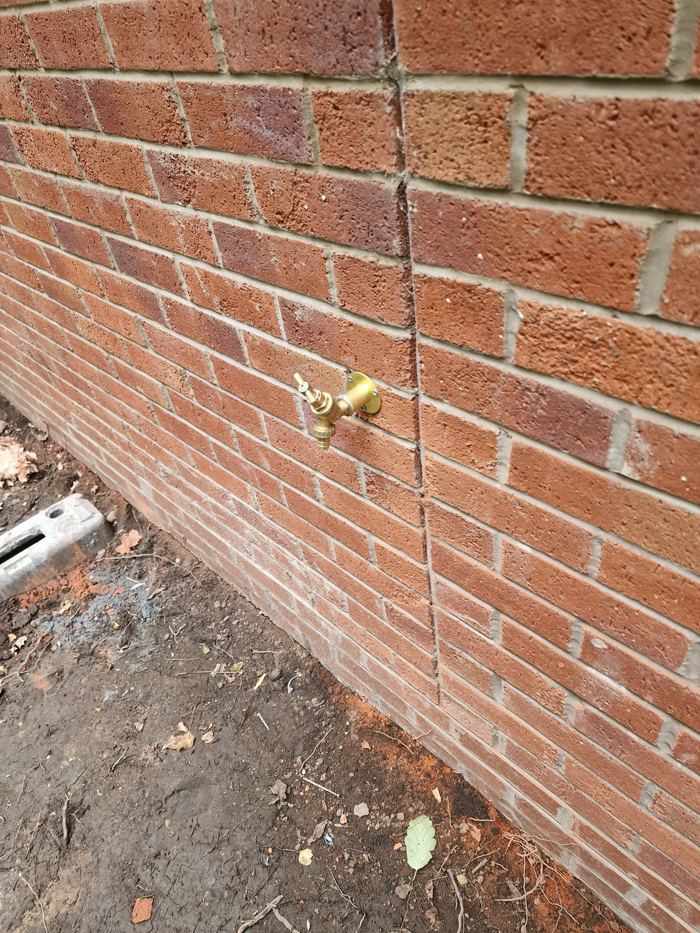 Outside tap fitted to a brick wall